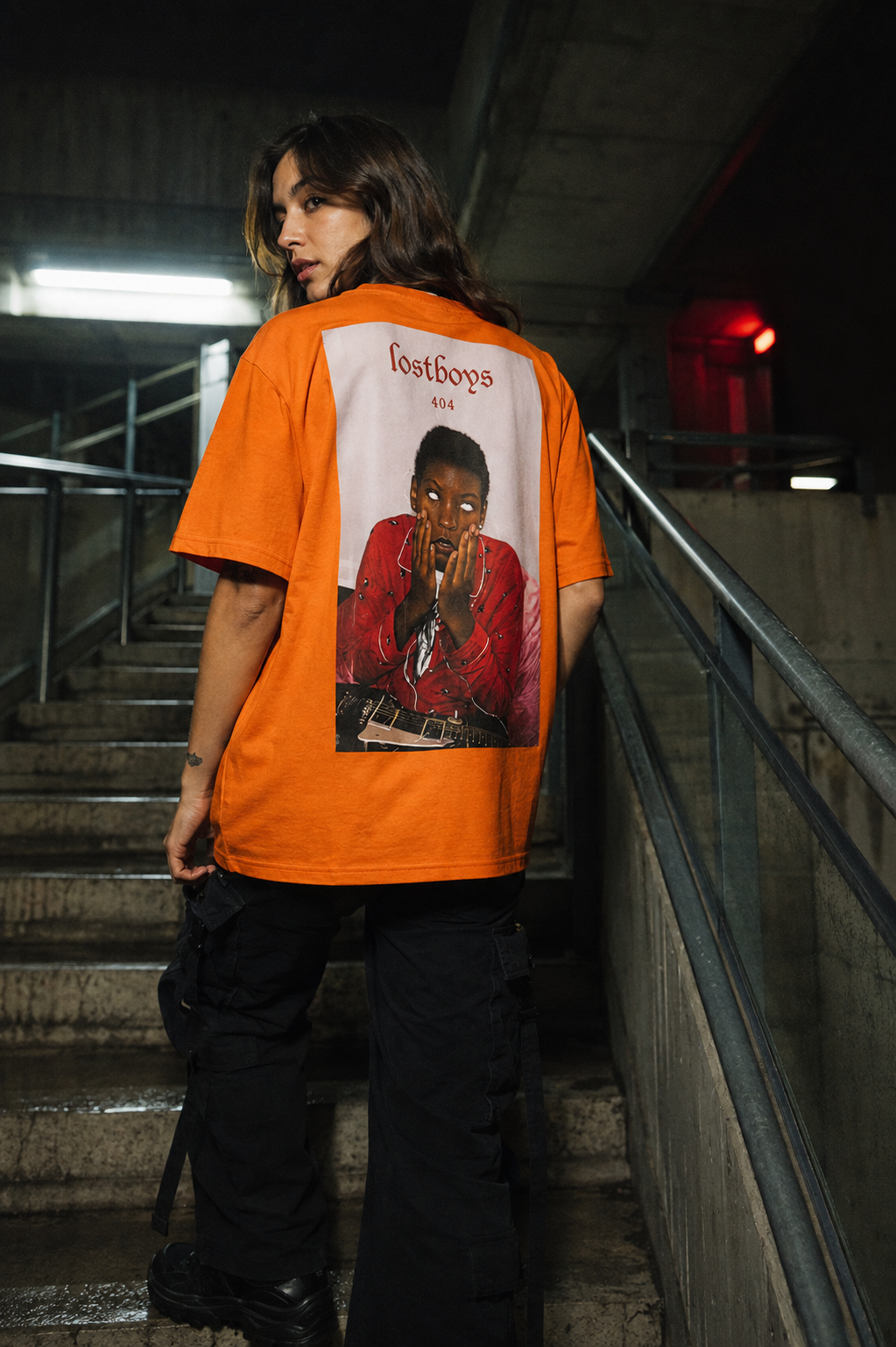 Streetwear editorial in a concrete stairwell